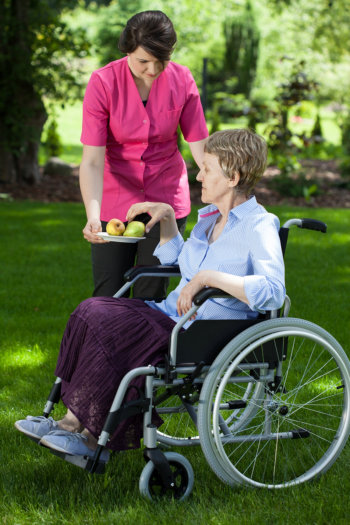 Clinician assisting patient outdoors